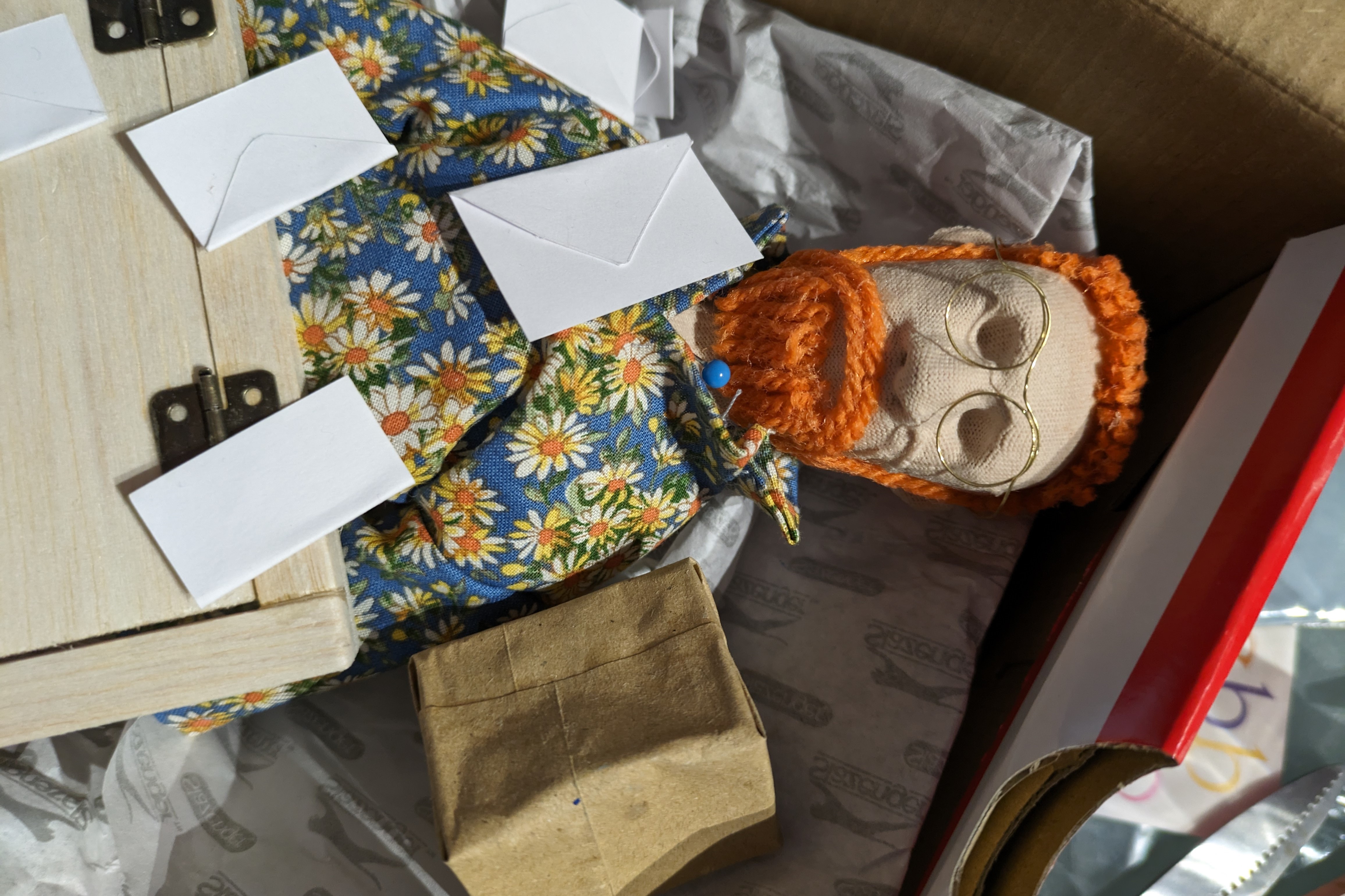 photo of a puppet covered in letters